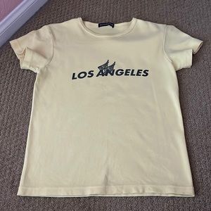 Brandy Melville pastel yellow “Los Angeles” graphic tee
